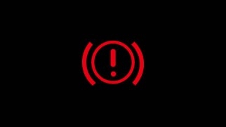 Icône rouge du témoin d’alerte du système de freinage avec cercle et point d’exclamation sur fond noir.
